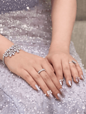 Elegant lavender shimmer gelx extension nail art with floral design by Riri Nails in Muscat Oman