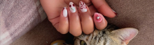 Builder gel nail design at Riri Nails salon in Muscat, Oman featuring nude pink manicure with cute cat.