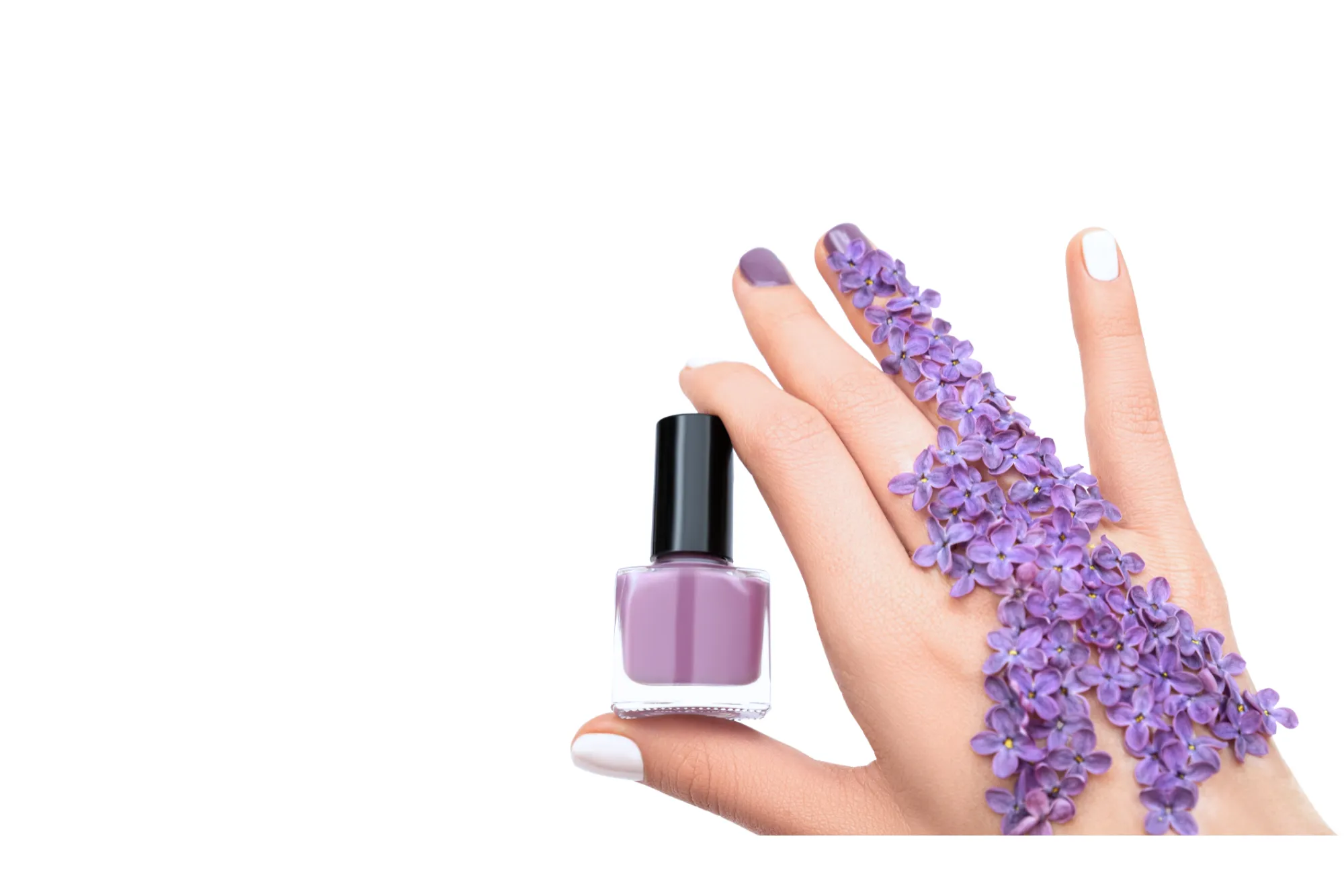 Purple bloom nail art and gel manicure by Riri Nails Oman featuring lilac flowers on the hand for a creative floral design look